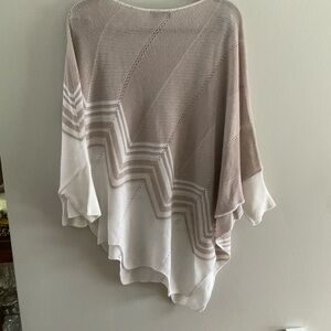 Poncho. The arms have sleeves.